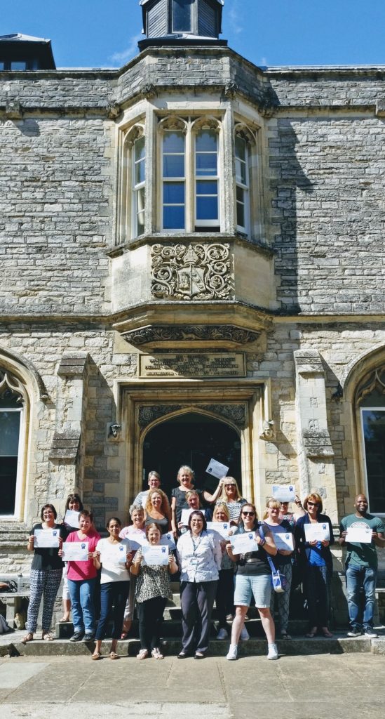 Participants show off their certificates